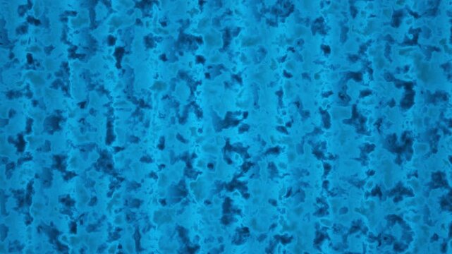 Seamless looping abstract background featuring textured blue patterns