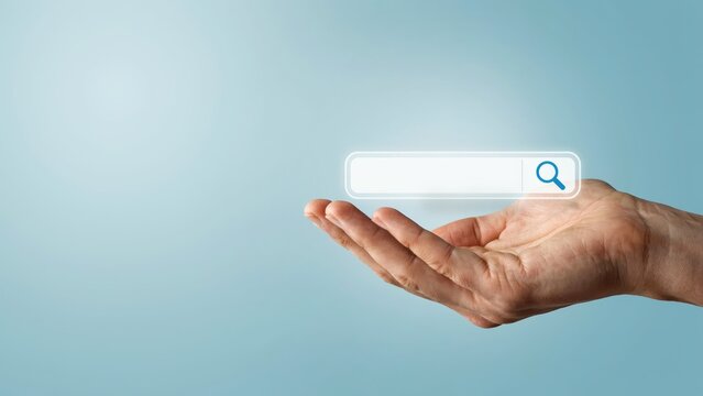 A human hand holds a glowing search bar interface for digital navigation and internet browsing tasks