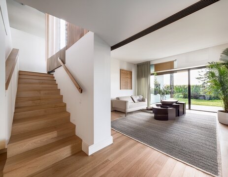 modern white residence with sleek laminate wood staircase