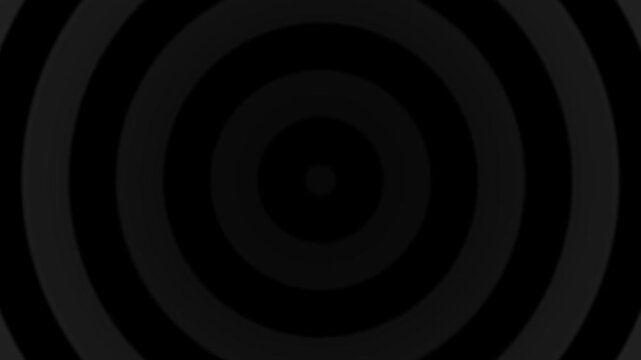 Abstract hypnotic circles in grayscale create a seamless looping effect for background use.