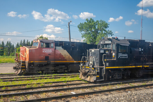 Quebec City, Quebec, Canada. July 27, 2026. Side view profile of CN and Illinois Central diesel locomotives parked on railway tracks.