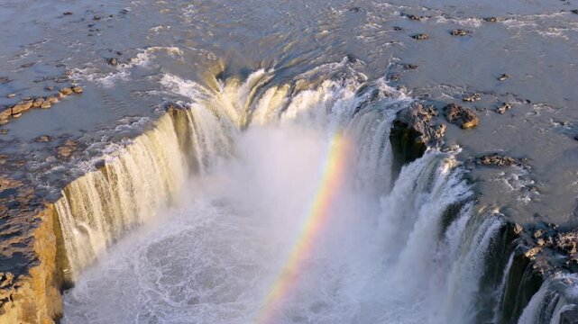 Aerial. Majestic waterfall Selfoss over basalt cliffs. Vast volcanic landscape with rushing river and mist. Iceland