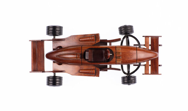 Wooden sports car toy isolated on white background