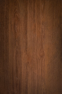 Dark wood background texture. Rustic wooden surface grain of deep brown board top view.