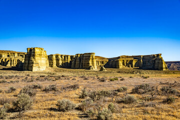 Fototapeta premium Pillars of Rome rock formations glow at sunrise
