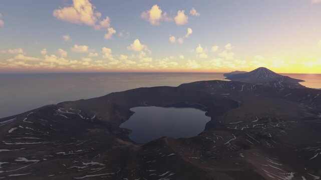 Sunset aerial drone shot of the snow at Vulkan Zavaritskogo in Kuril Islands. Sakhalin Oblast. Russia