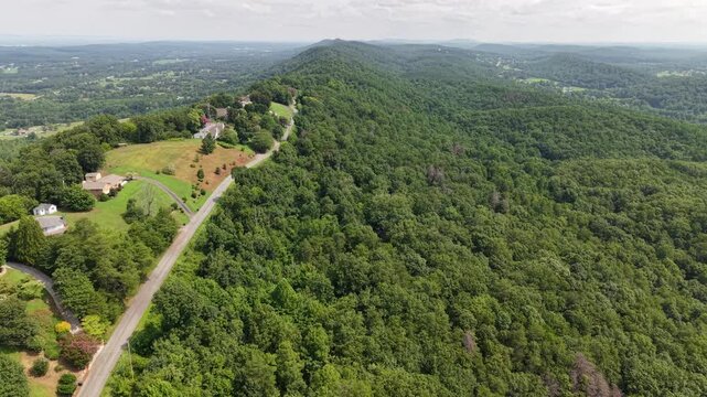 Aerial View of Winding Dirt Road Through Forested Hills Near Ringgold, Georgia