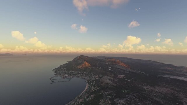 Circular aerial shot at sunrise of North Peak in Simonstown. Cape Town. South Africa
