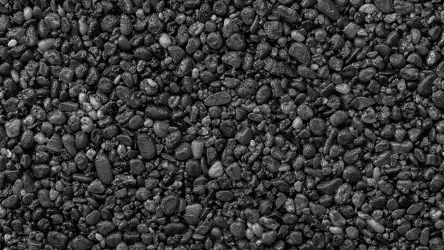 Abstract pebbles background with black snones wall grain grunge  texture for web banner template or wallpaper design