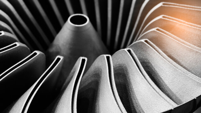 Close-up of 3D-printed metal turbine. machined surface reveals precise details. innovative additive technologies concept background