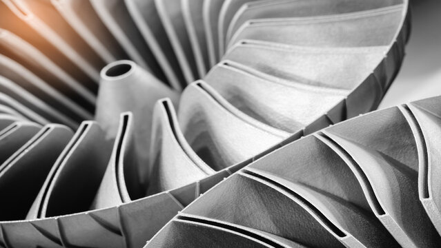 Close-up of 3D-printed metal turbine. machined surface reveals precise details. innovative additive technologies concept background