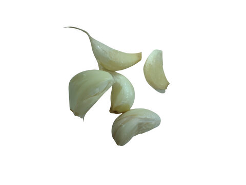 Fresh peeled garlic cloves on a flat surface