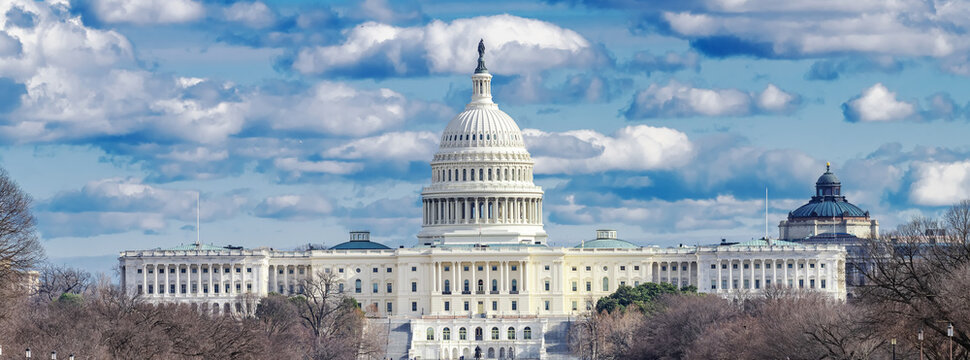 Capitol Skyline Beneath Towering Summer Clouds in Washington DC Panoramic City View.