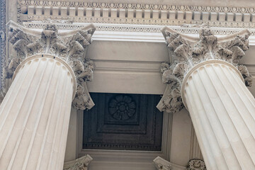 Symmetrical Corinthian colonnade beneath coffered portico ceiling in Washington DC USA © kosoff