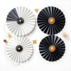 Obraz premium Black and white paper fan decorations with gold accents and festive ornaments on a clean background, this elegant display features a minimalist design
