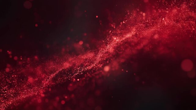 Abstract red glitter and particles with bokeh effect on dark background