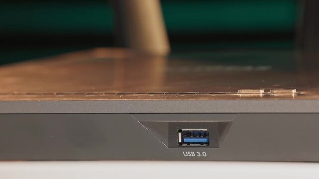 Close up slow motion studio shot of USB 3 3.0 female port and insert entry point for computer and technology cables for accessories to enter modern device as rectangular universal serial bus devices
