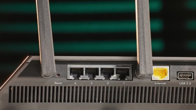 Slow motion detailed view of wireless internet router machine for antenna modem connection to online virtual world, with device having antennas, ethernet ports, usb, and computer 5g wifi connections