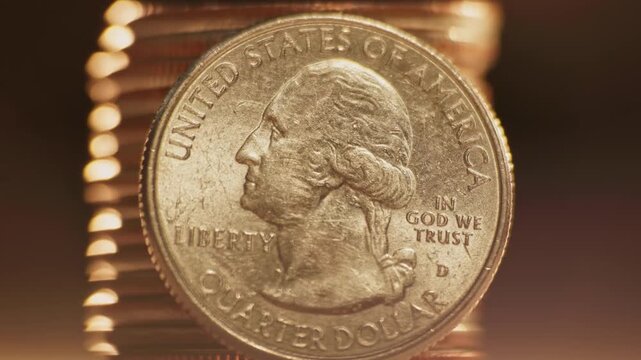 Close-up detailed macro view of George Washington on United States of America 25 cents coin worth one quarter of a dollar and quoting liberty and In God We Trust on money surface and U.S. currency 4k
