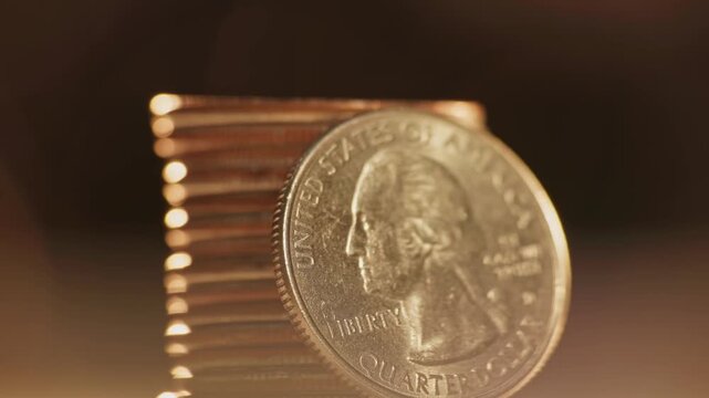 Close-up detailed macro view of George Washington on United States of America 25 cents coin worth one quarter of a dollar and quoting liberty and In God We Trust on money surface and U.S. currency 4k