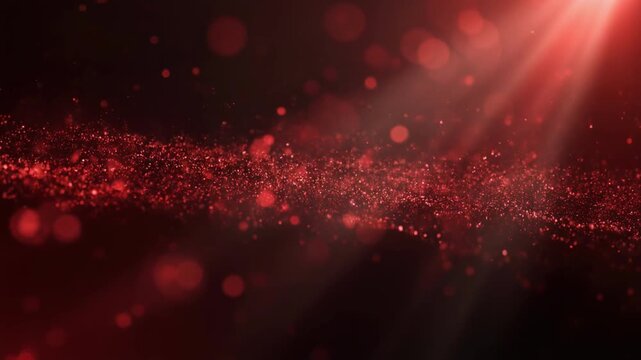 Red glowing particles floating against a dark background with light rays