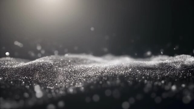 Abstract wave of glowing silver particles on a dark background