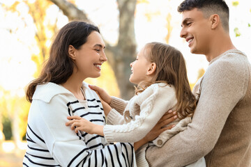 Fototapeta premium Happy family spending time together in beautiful autumn park