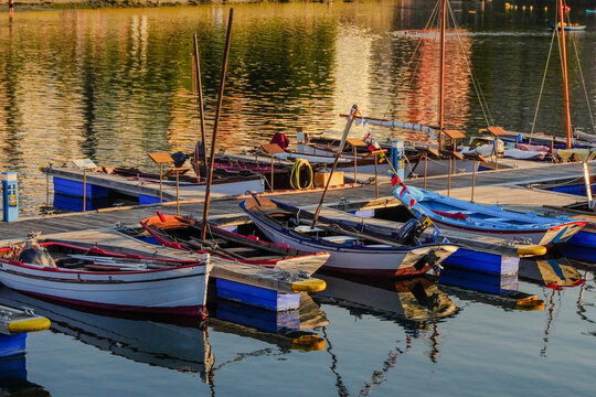 Traditional wooden fishing boats moored at a pontoon 
