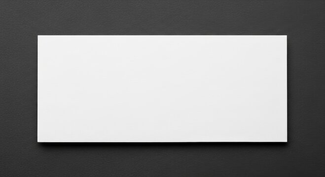 Blank white paper rectangle placed on a dark background. Minimalist stationery layout with shadow for branding presentation. Empty frame for mockup, creative design and advertising message.
