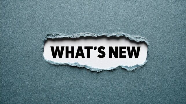Bold black text What's New appearing behind a ragged tear in dark blue paper. Concept for news or product updates.