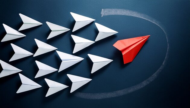red paper airplane changing direction from white airplanes on dark blue background symbolizing leadership disruptive innovation and strategic vision
