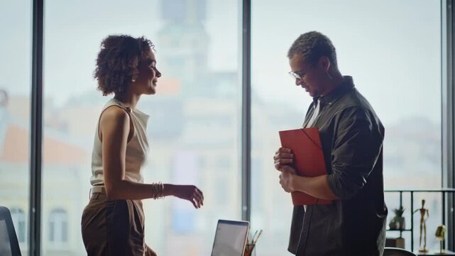 Colleagues discussing documents office meeting. Business partners sharing folder