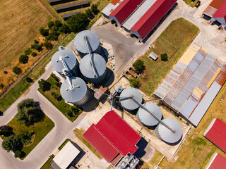 Farm layout with silos and buildings in an agricultural setting captured from above during daylight © DSMT