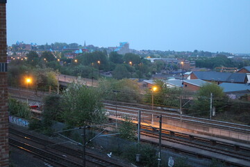 Obraz premium Urban railway tracks, overhead electrical lines, and station infrastructure during daylight Newcastle