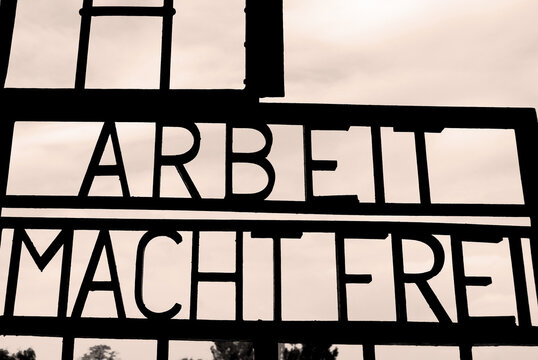 SACHSENHAUSEN ORANIENBURG, GERMANY: Inscription ARBEIT MACHT FREI on the gates to the former Nazi concentration camp, now the Sachsenhausen National Memorial,