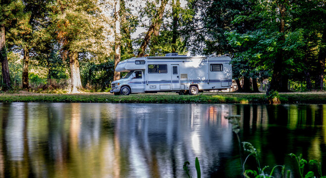 Family trip in motorhome in forest or park in South Chile