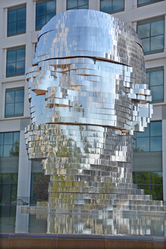 METALmorphosis is a large (7 meters; weighing 13 tons) kinetic sculpture of a human head, by Czech artist David Cerny. The sculpture is in the Whitehall Corporate Center in Charlotte, North Carolina