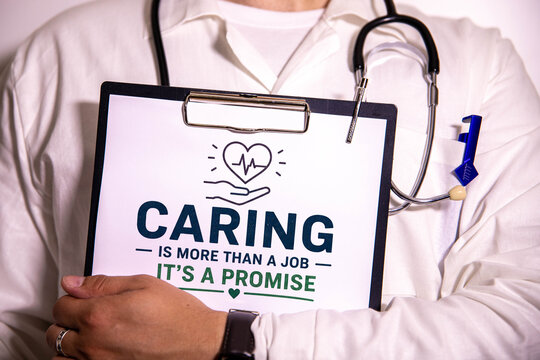 Caring Is More Than a Job It's a Promise Concept on Clipboard Held by Healthcare Professional.