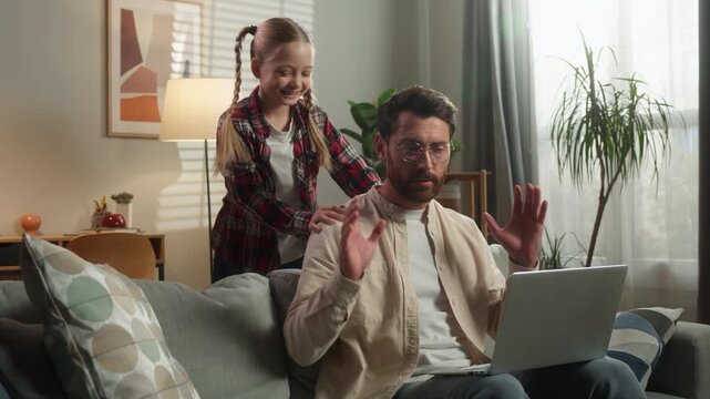 Caucasian family problem busy father talk daughter noisy bad behavior distract man working laptop distant work at home little kid girl naughty energetic child parenthood trouble stress angry dad male