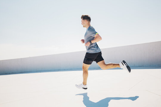 Sweeping across the rooftop under the bright sun, a runner embraces freedom and motion