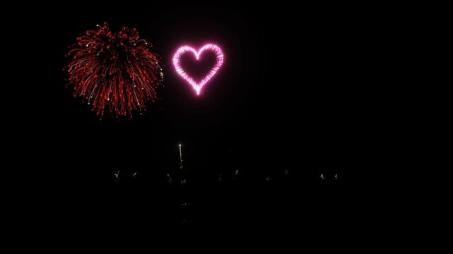 A dynamic display of colorful fireworks exploding into starburst patterns and symmetrical light effects in a darkened sky. 3D Render