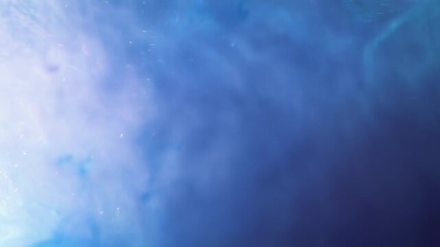 4K Blue Liquid Abstract Background. Flowing Ink, Glitter Particles and Fluid Motion, Macro Texture Video, 2160p