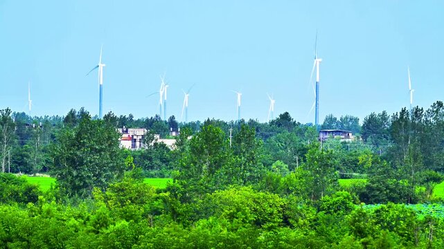 Wind turbines on ridge with village shelterbelt