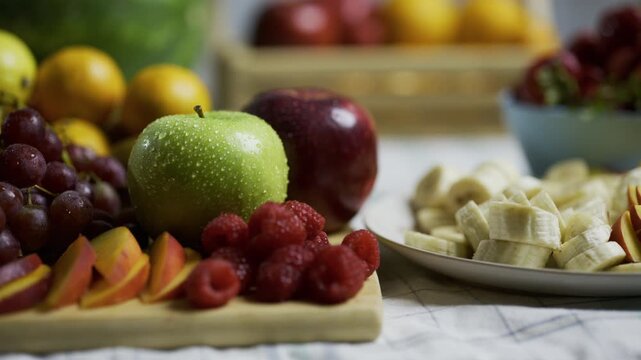 Kitchen counter filled with fruit platters - closeup, tracking shot