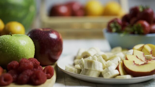 Moist, delicious looking fruit on plates in kitchen - tracking shot