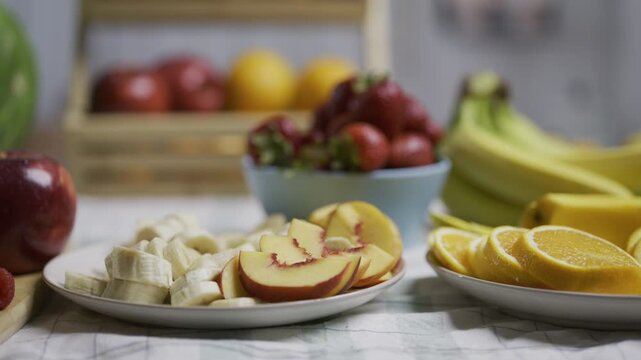 Yummy sliced fruit on kitchen counter - closeup tracking shot