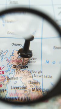 Magnifying glass highlights location on map of Glasgow