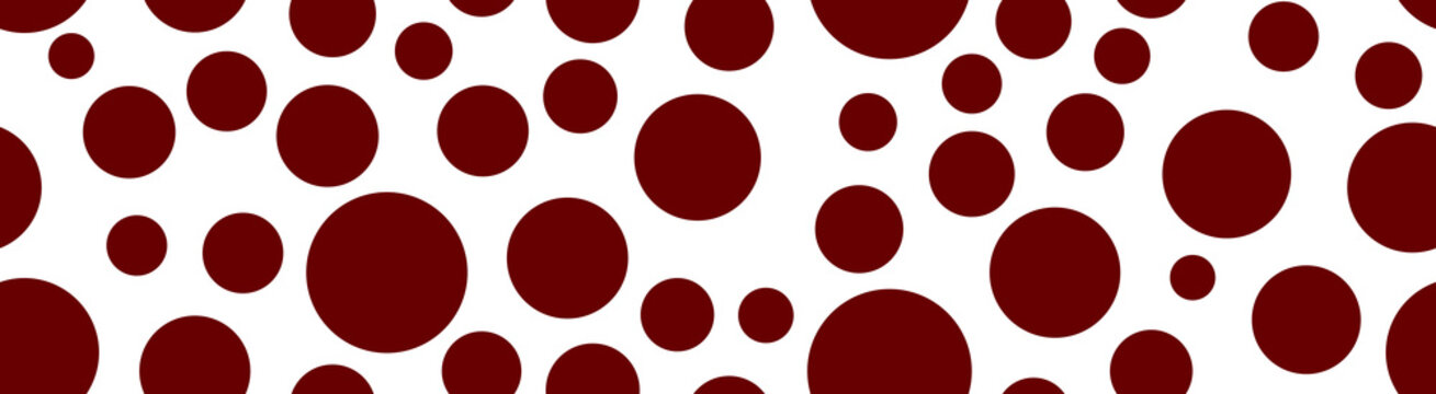 A playful horizontal banner displaying a variety of deep red circular dots of different sizes, scattered across a white background.