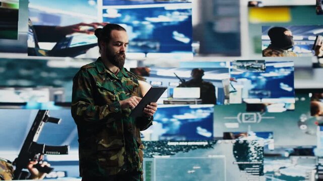 Military officer coordinates tactical surveillance from a command center, integrating intelligence data and artificial intelligence systems for battlefield efficiency and defense planning.