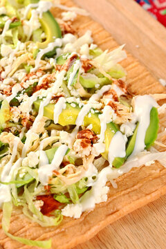 Mexican chicharron preparado with lettuce, avocado, sour cream and hot sauce